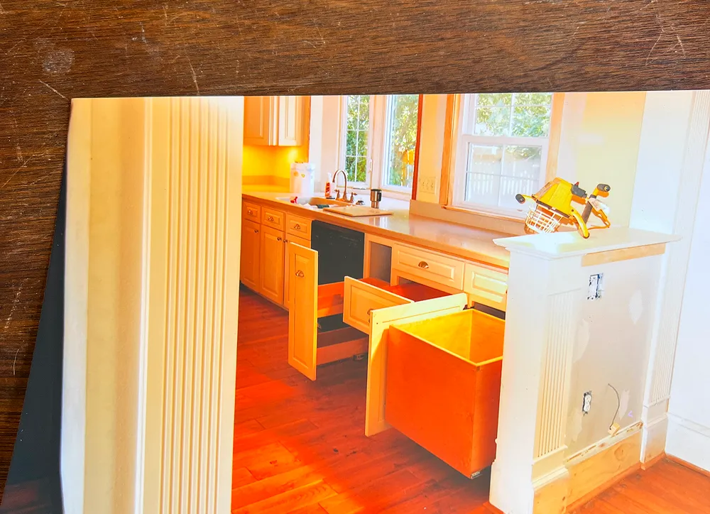 Kitchen with open cabinets and drawers.