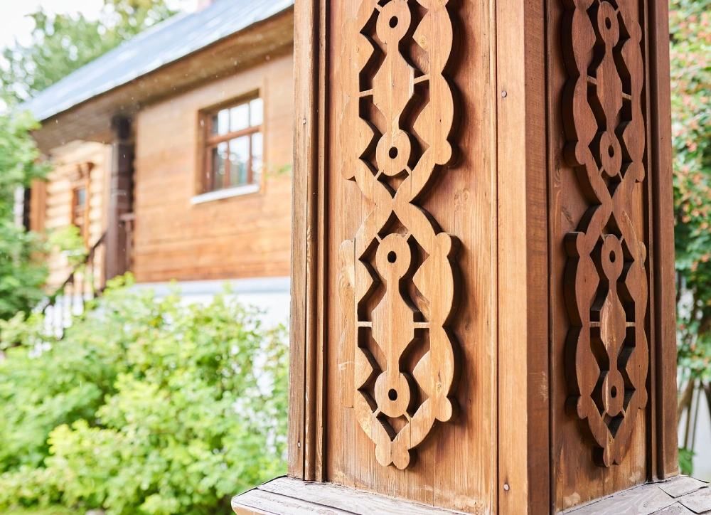 Ornate wooden pillar with intricate carvings