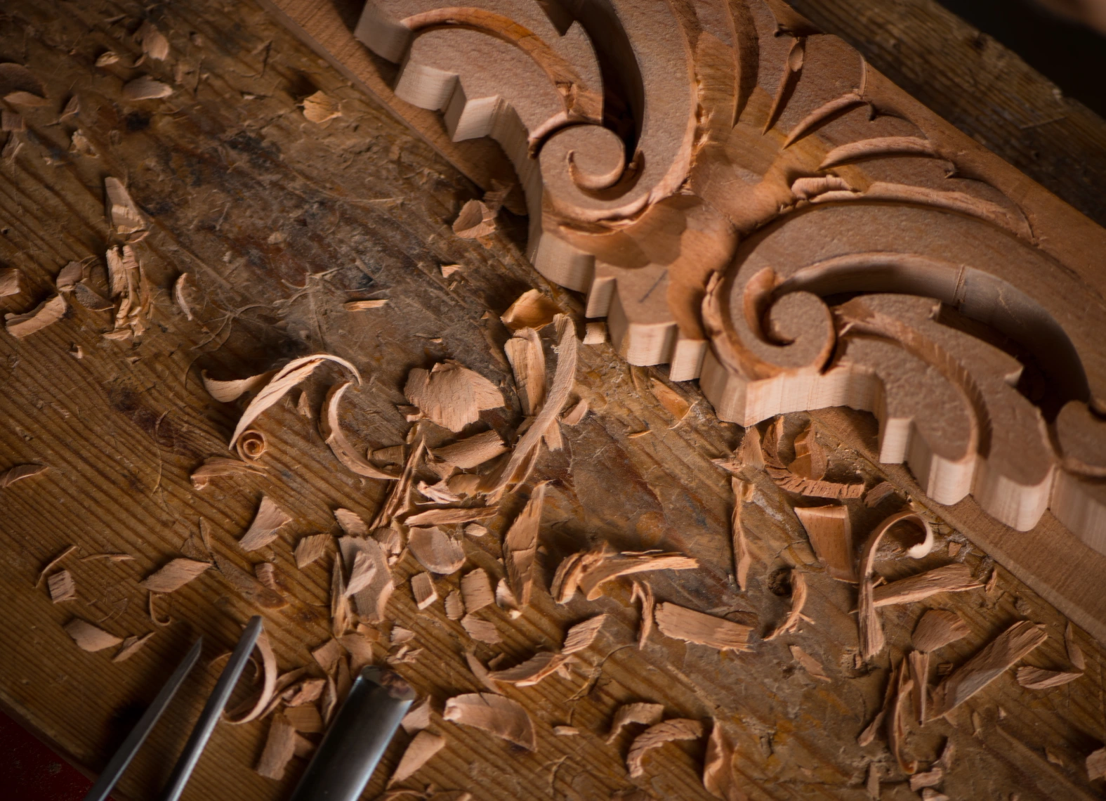 Intricate woodwork with carving tools