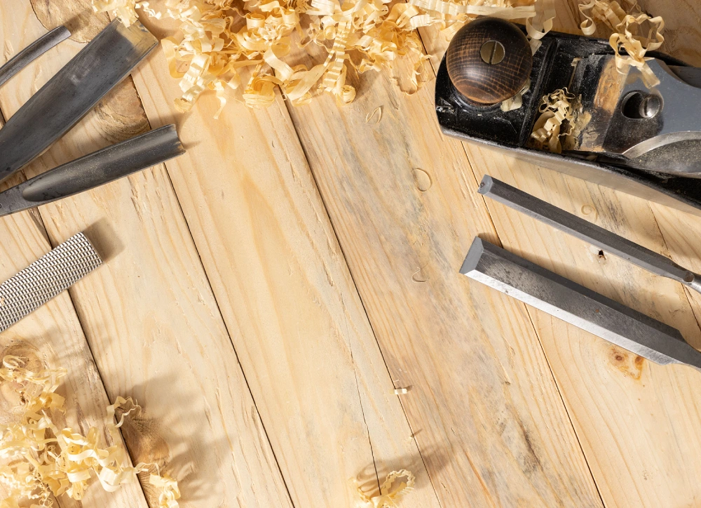 Woodworking tools and shavings on table