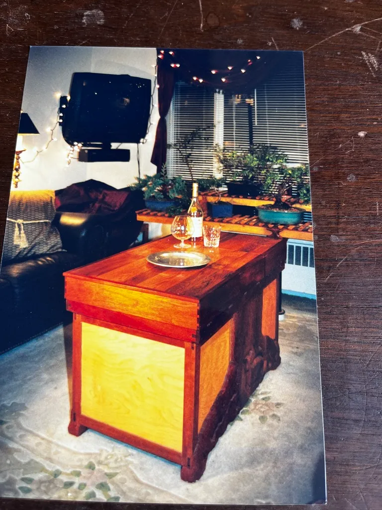 Wooden table with wine and glasses.