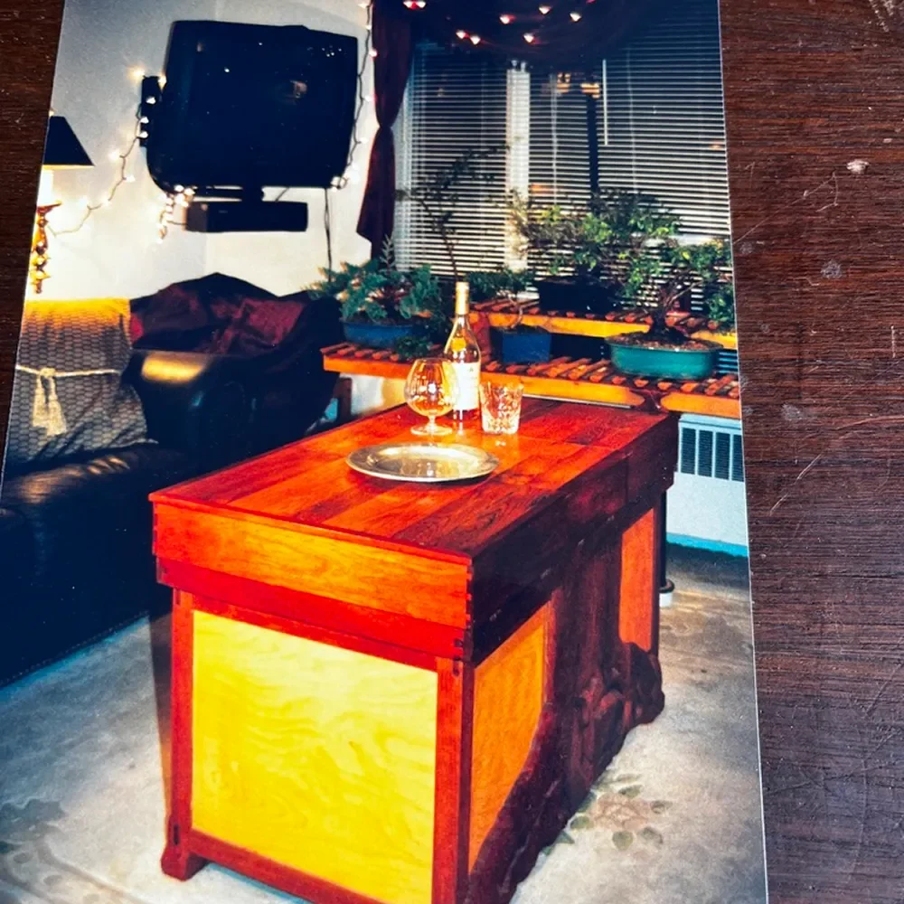 Living room with wooden table and TV.